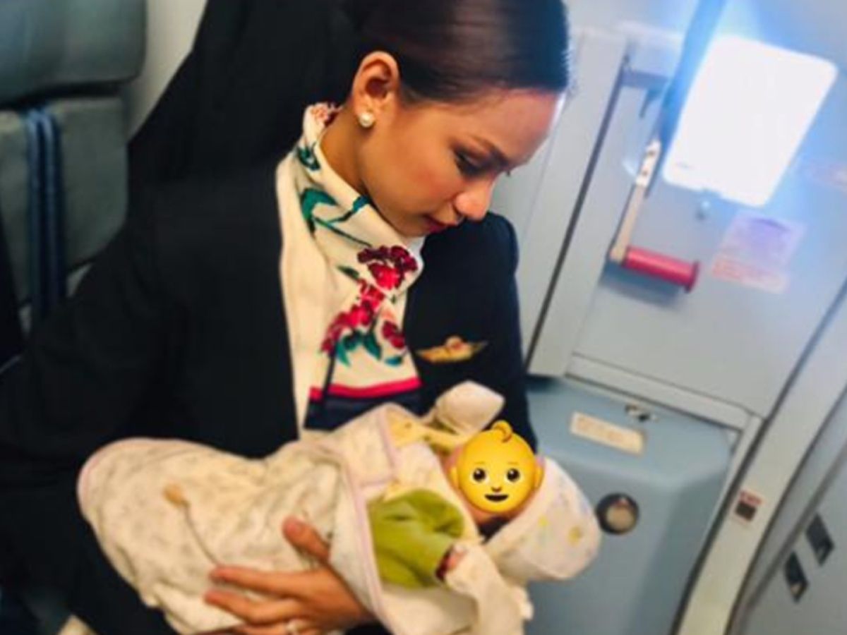 This Air Hostess Breastfeeds The Baby Of A Strange Woman