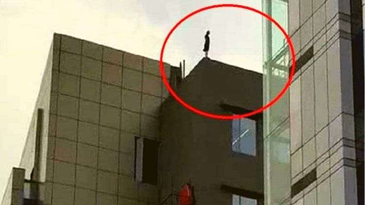 Woman Dramatically Threatens To Jump Off Building After Getting Fired From Her Job 