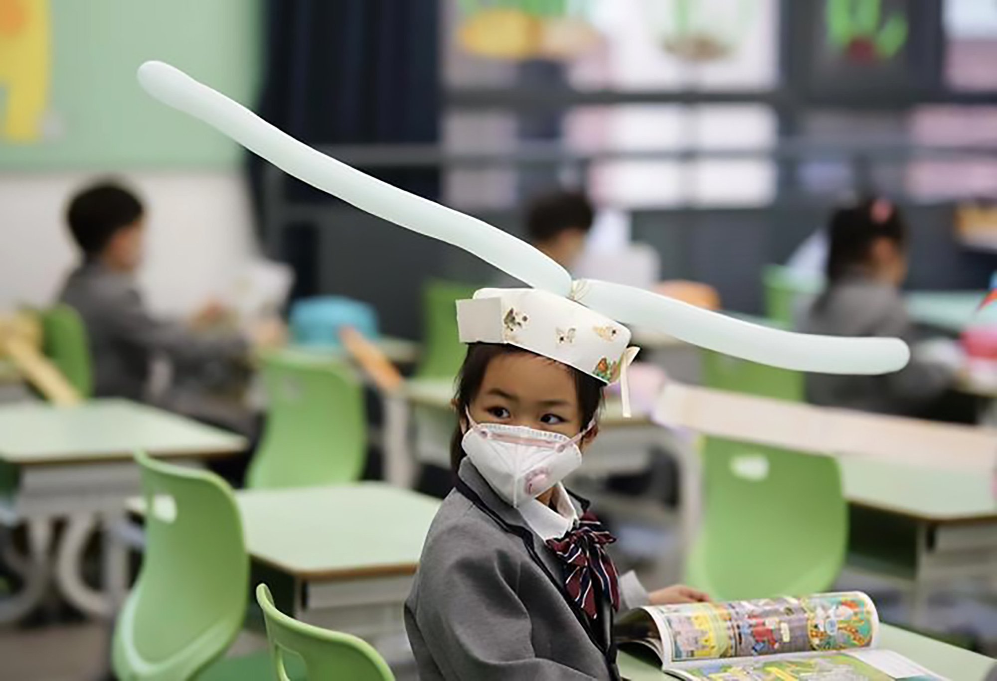 Kids in China Return To School With Home-made Social Distancing Hats