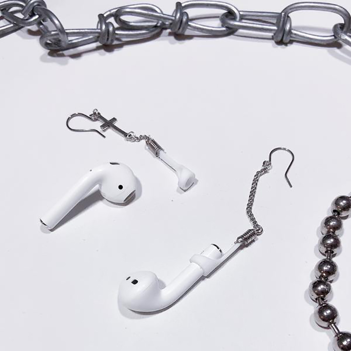 apple airpods, earrings, 22-year-old woman