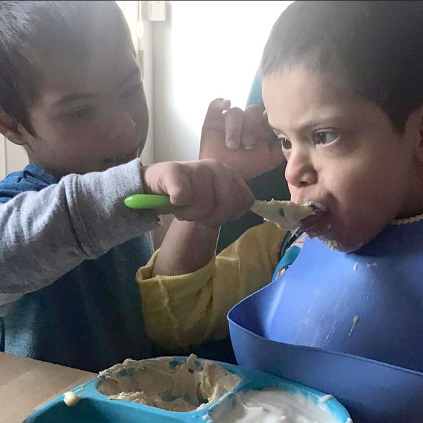 adopted boy with down's syndrome helps two disabled brothers