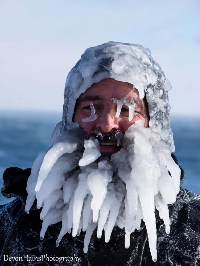 Two Surfers Catch Waves During Polar Vortex