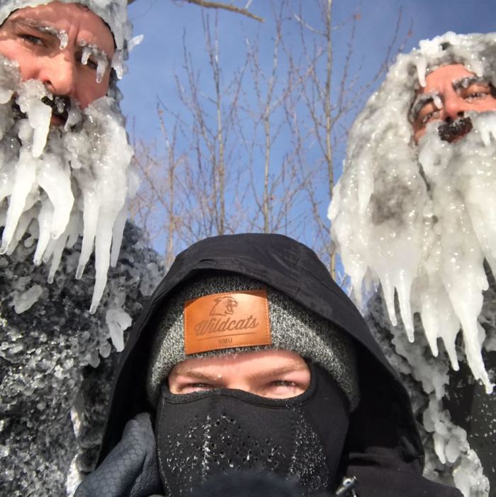 Two Surfers Catch Waves During Polar Vortex