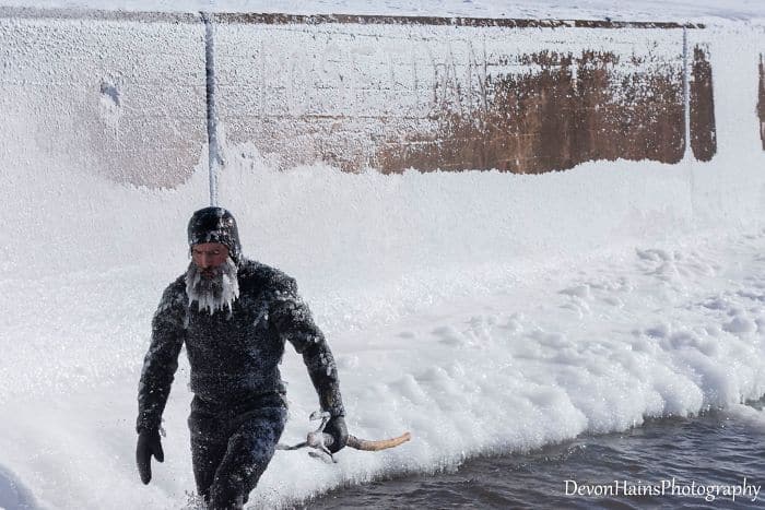 Two Surfers Catch Waves During Polar Vortex