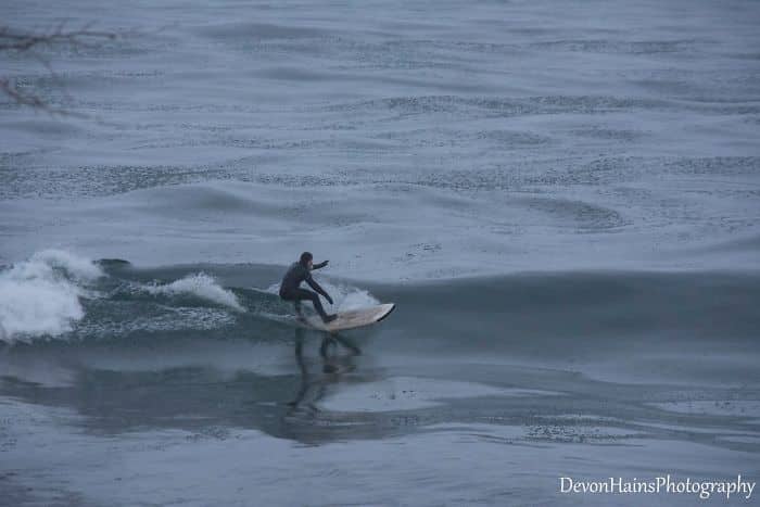Two Surfers Catch Waves During Polar Vortex