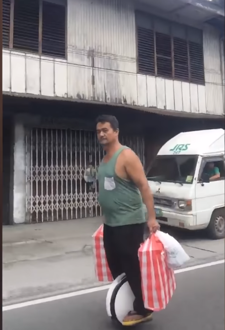 Filipino Waiter Delivers Food On A Hover Unicycle With Full Swag