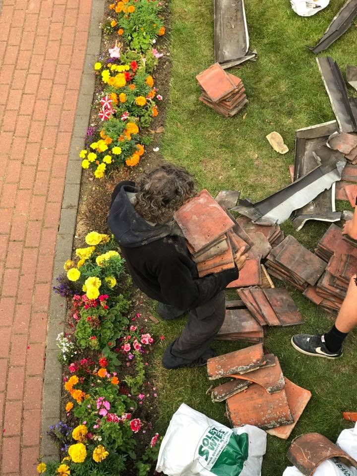 Roofers help homeless man with work