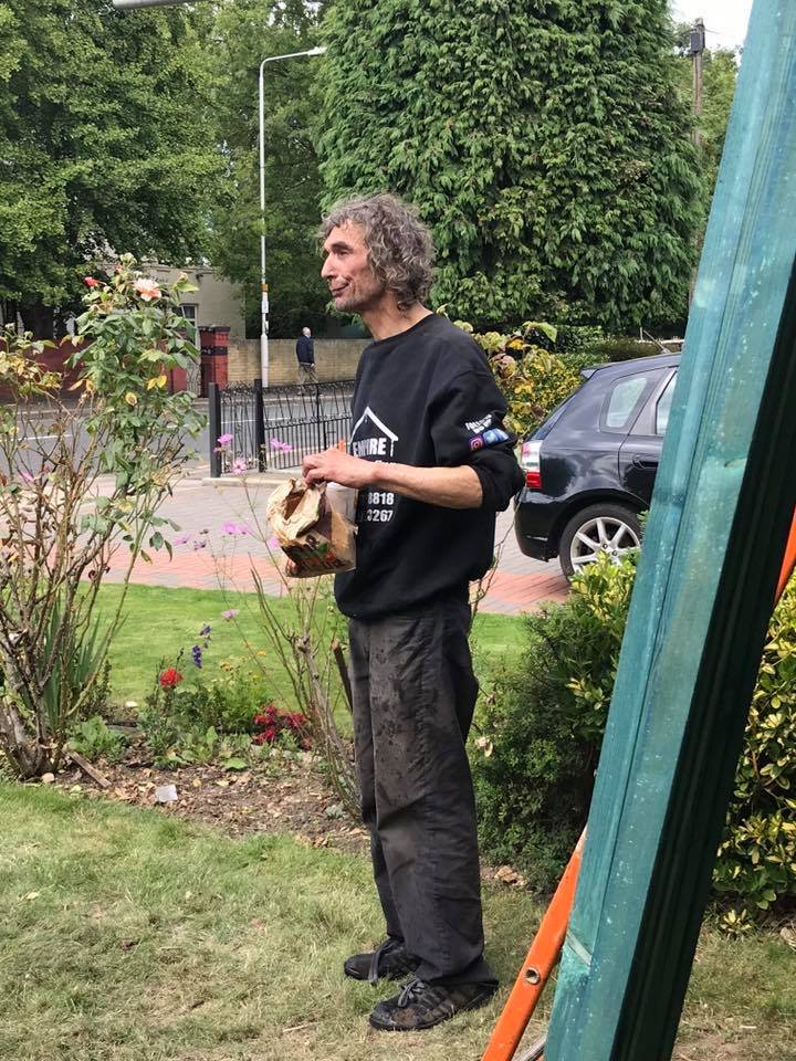 Roofers help homeless man with work