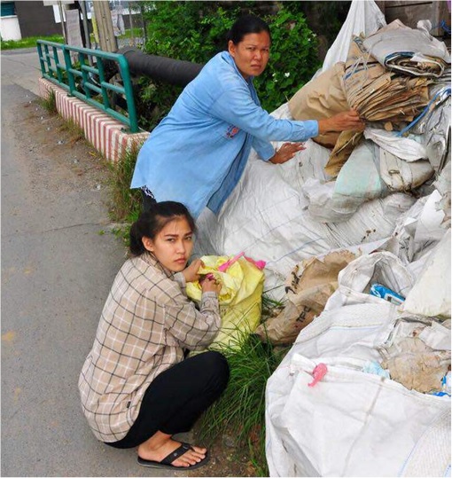 Mint and her mother picking up garbage together