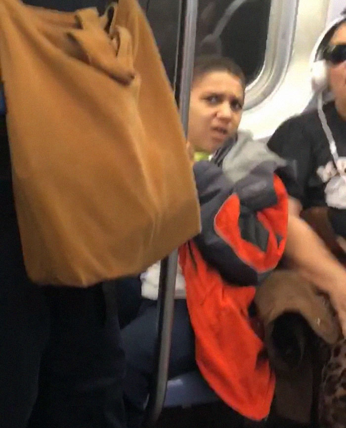Kid on subway with man