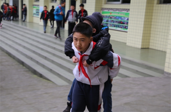 This 12 Year Old Boy Carried His Best Friend To Class On his Back Everyday For Six Years