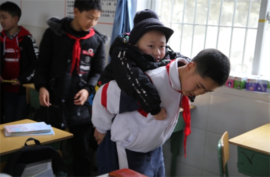 This 12 Year Old Boy Carried His Best Friend To Class On his Back Everyday For Six Years