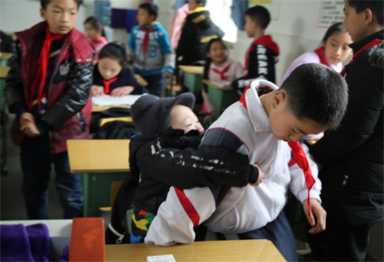 This 12 Year Old Boy Carried His Best Friend To Class On his Back Everyday For Six Years