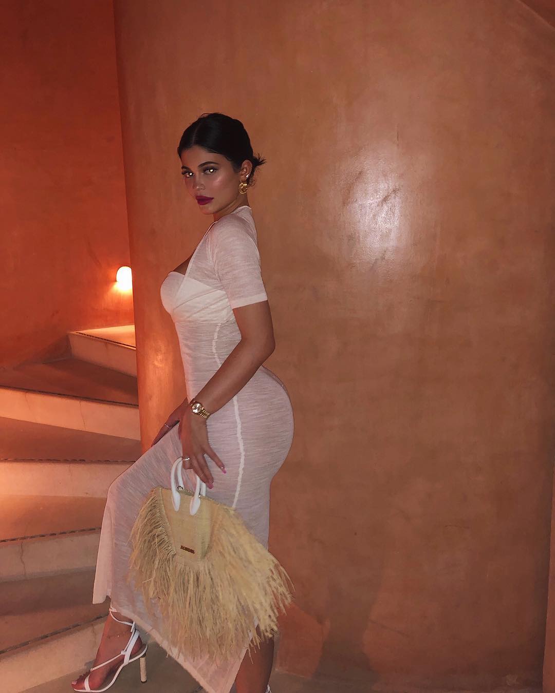 Kylie Jenner Posts Images From Her Vacation With Travis Scott Wearing A Sheer Dress