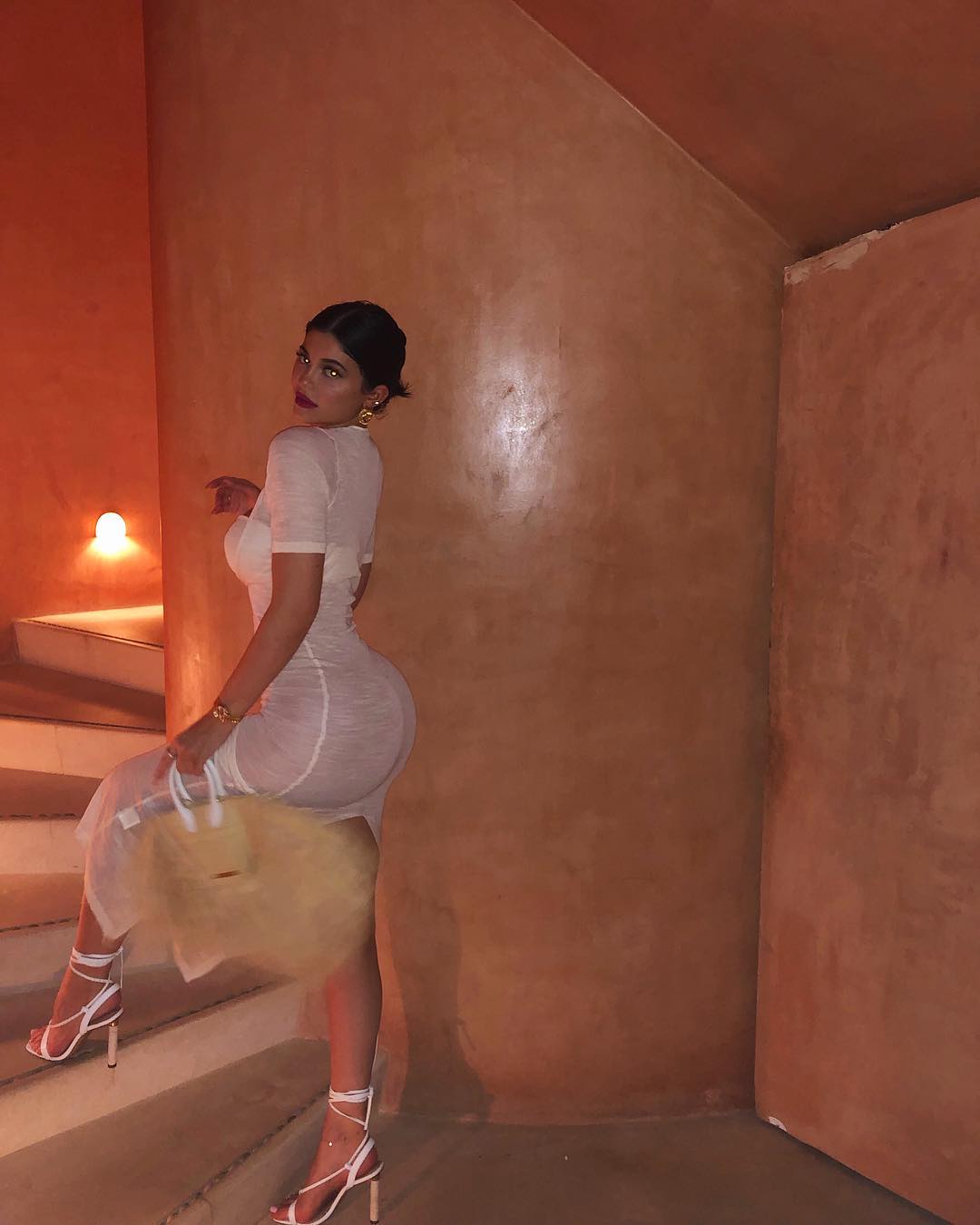 Kylie Jenner Posts Images From Her Vacation With Travis Scott Wearing A Sheer Dress