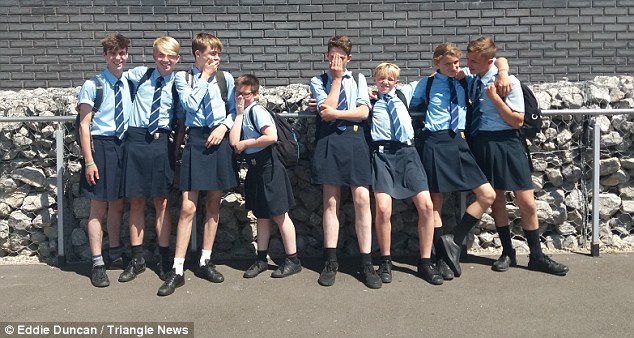 Boys in high school choose to wear skirts after management bans them from wearing shorts in high temperatures