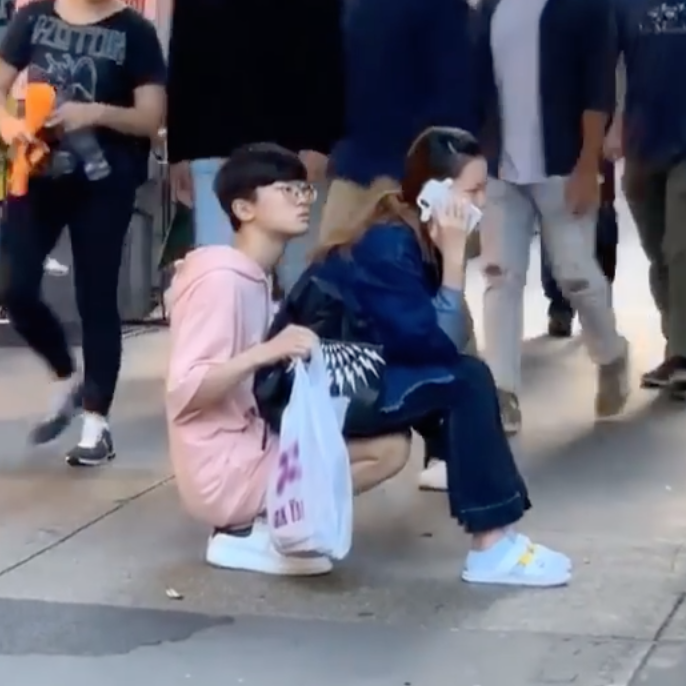 Man Showed His Love To Girlfriend By Becoming Like A Chair For Her Girlfriend To Sit On A Side Walk