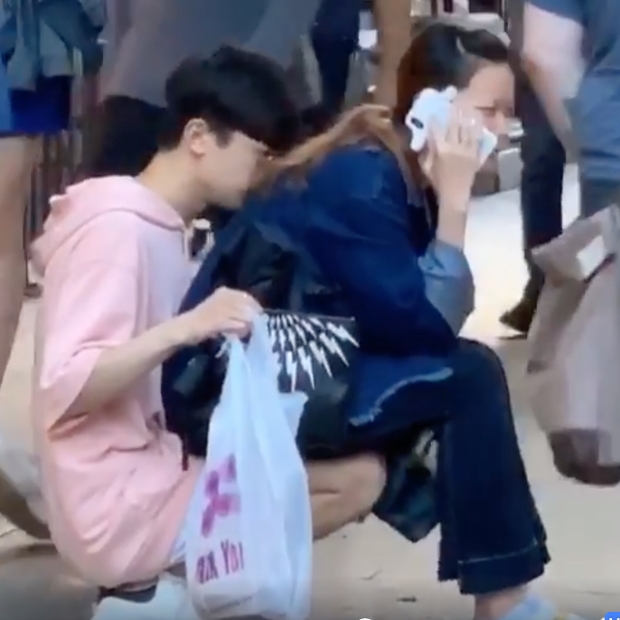 Man Showed His Love To Girlfriend By Becoming Like A Chair For Her Girlfriend To Sit On A Side Walk