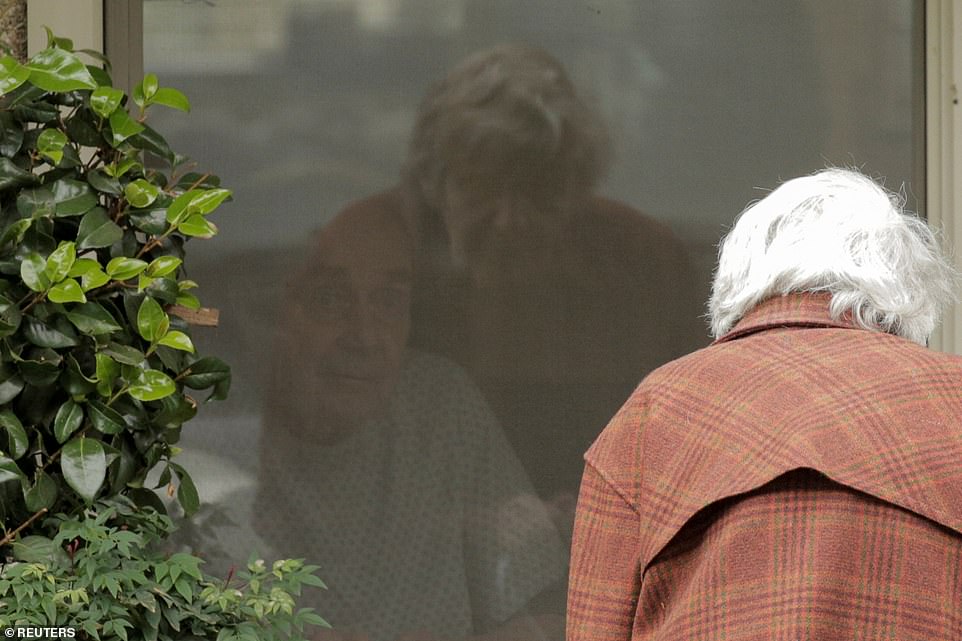 Heartbreaking Picture Shows Elderly Couple Separated by Coronavirus Lock-down 