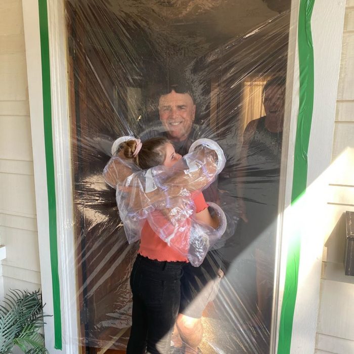 Little Girl Invents Hug Curtains Made of Plastic To Hug Her Grandparents Amid Pandemic