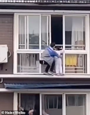 Chinese Man Scales Tall Building With Bare Hands To Save A Kid Hanging from Balcony