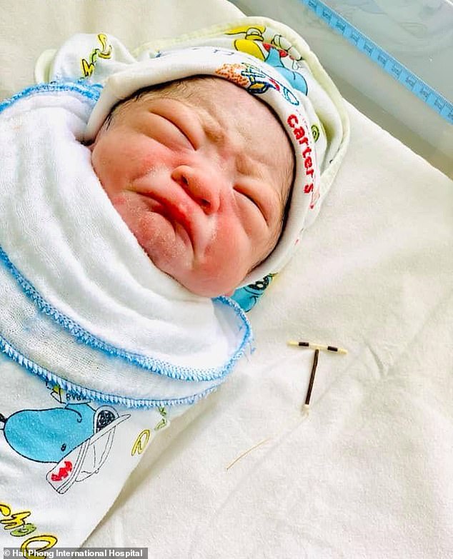 Picture Of A New-born Baby Holding Mother's Birth-Preventing IUD Goes Viral